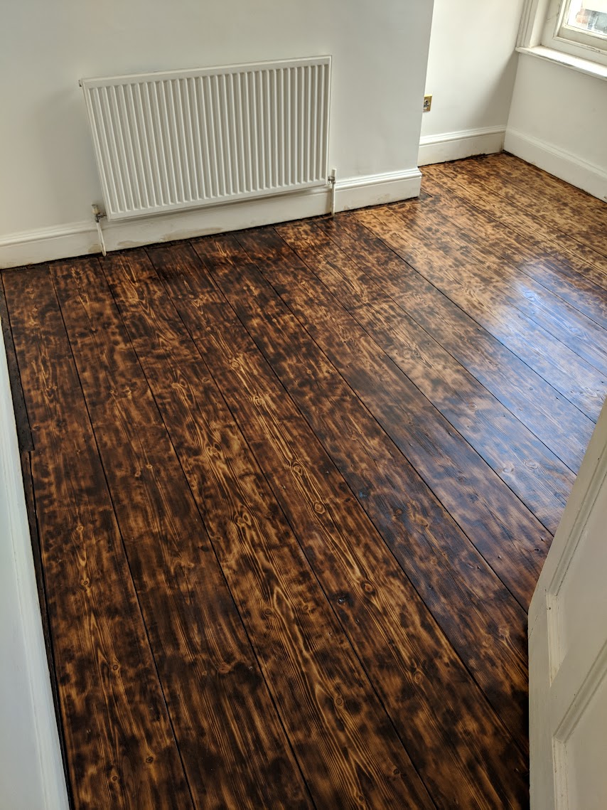 Burn finish floorboards